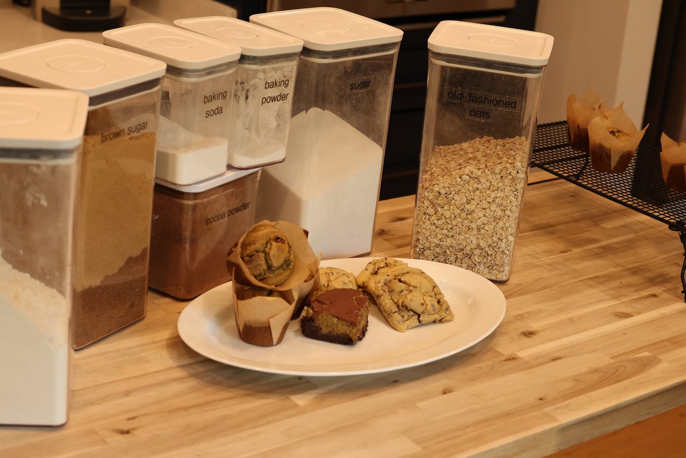 Cookies, a muffin, and a brownie square plated together