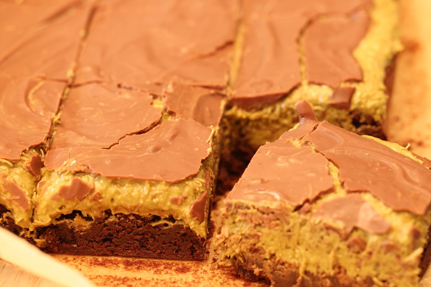 Close-up of Dubai Crunch bars topped with chocolate and pistachio